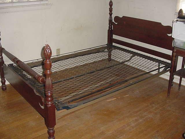 Great old turn of the century mahoghany bed with the old steel springs supports