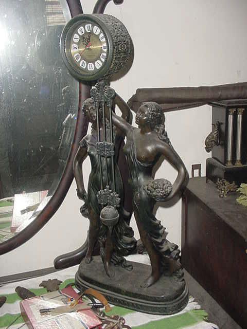 ....as I said previously..a stunning antique bronze clock, about 24" high