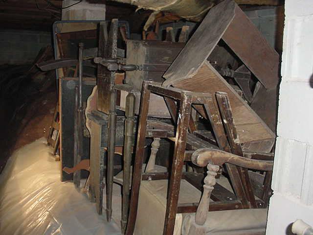 Stacks and stacks of old chairs, tables, stools, etc.