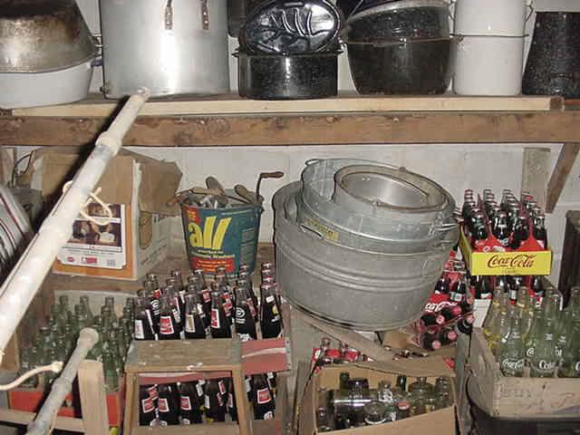 More of the old bottles, tubs, metal pails, advertising, etc.