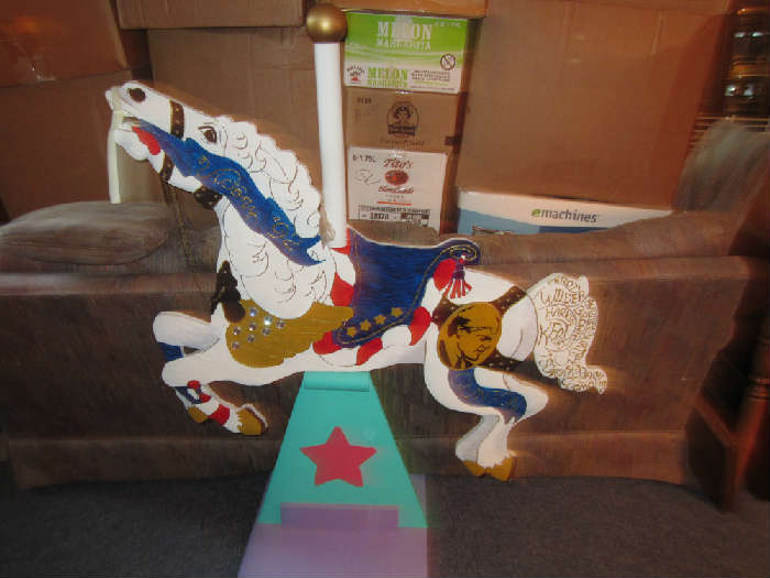 carousel horse with  Bill Clinton's photo