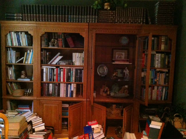 four section bookshelves one unit has leaded glass doors