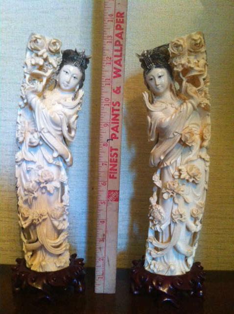 A FABULOUS PAIR OF CARVED IVORY FIGURINES....THE LARGEST AT THIS SALE