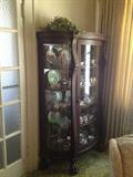 Beautiful bow front oak china cabinet with carved feet