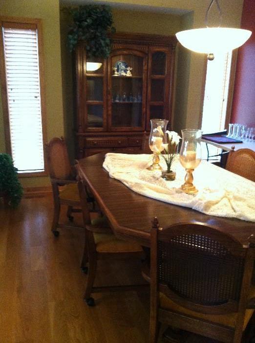 Dining table with 6 hand caned chairs with coasters & dark oak hutch