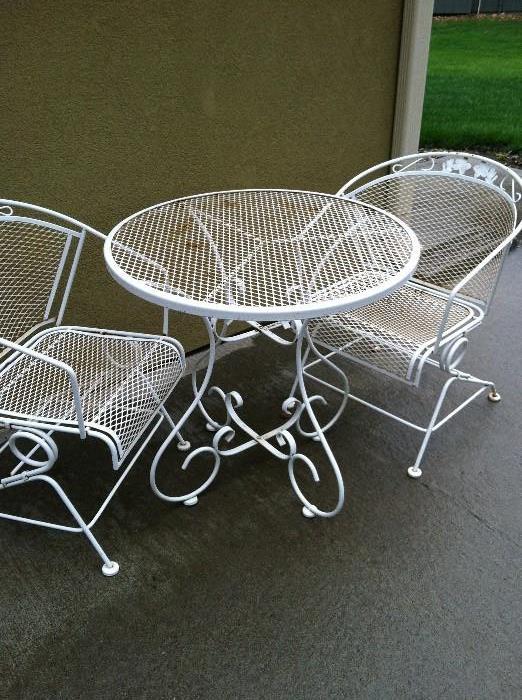 Wrought iron table with 2 chairs
