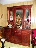 Beautiful and nicely carved buffet hutch. Lots of storage for your treasures!