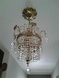 Beautiful vintage Austrian Crystal Chandelier!  Is approximately 15" long. Nice size for an entry way, great reflections on the ceiling. Quite the find!