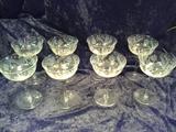 C19    American Brilliant Period Cut Crystal , Set of 9 crystal Martini coupe glasses 6” tall along with a Set of 5, 4 ½” tall Dessert crystal Stem wear, Approx. 50 years old * 1 small chip less than 1mm in the rim of one of the Martini Coupe & 2 small chips in 1 of the Dessert glasses.