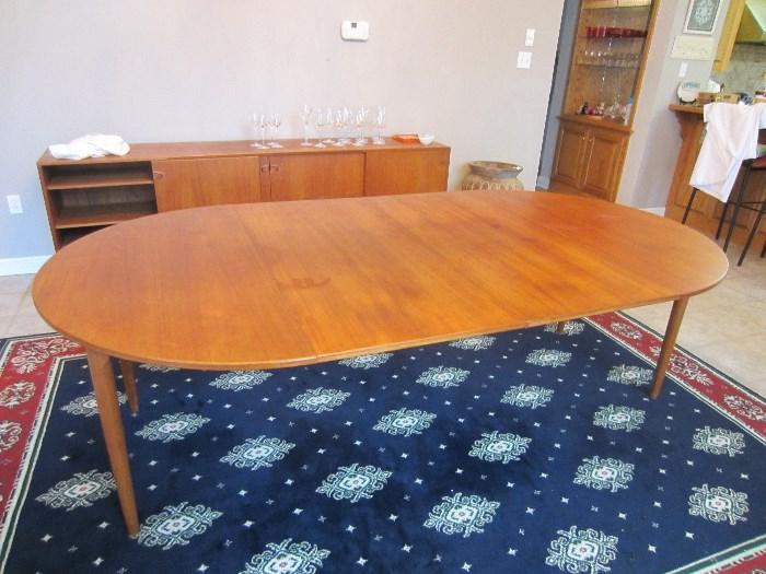 Danish Modern table,round with 2 large leaves.