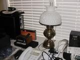 brass lamp with milk glass shade.
