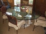 beautiful round glass top table with 6 cane / metal chairs
