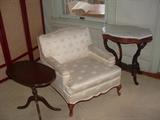 Upholstered chair and antique tables