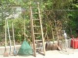 Wooden ladder and yard tools