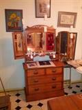 Small Chest with tri-fold mirror, more framed art.