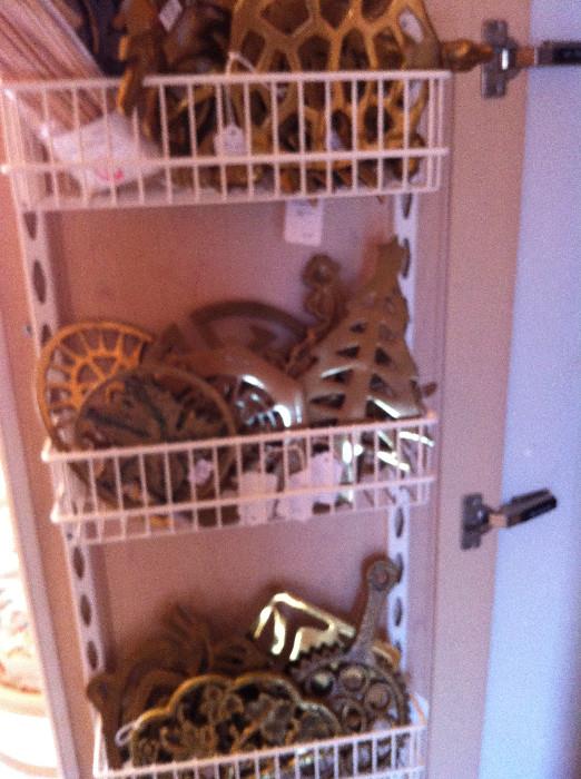 Over 20 brass trivets