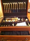                        Large set of gold flatware