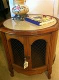                          Round 2-door end table