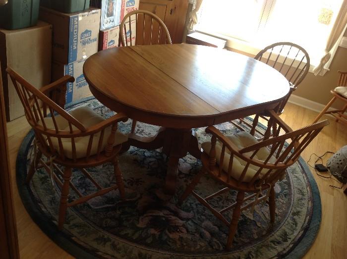Solid wood pedestal dining table with 6 Captain's chairs - 6.5' long (includes 1 leaf) $ 400.00