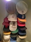 A larger collection of advertisement baseball caps than is shown here