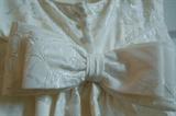 A brand new Saison Blanche Wedding Gown size 10.