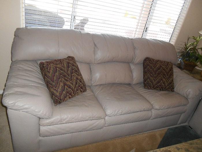 Can you believe this?  Soft-as-butter leather couch with matching love seat and oversized chair.