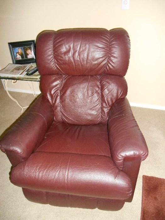 One of a pair of brown leather recliners