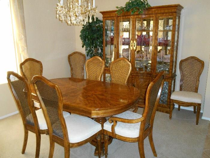 This dining room table and chair have a matching china hutch and bar
