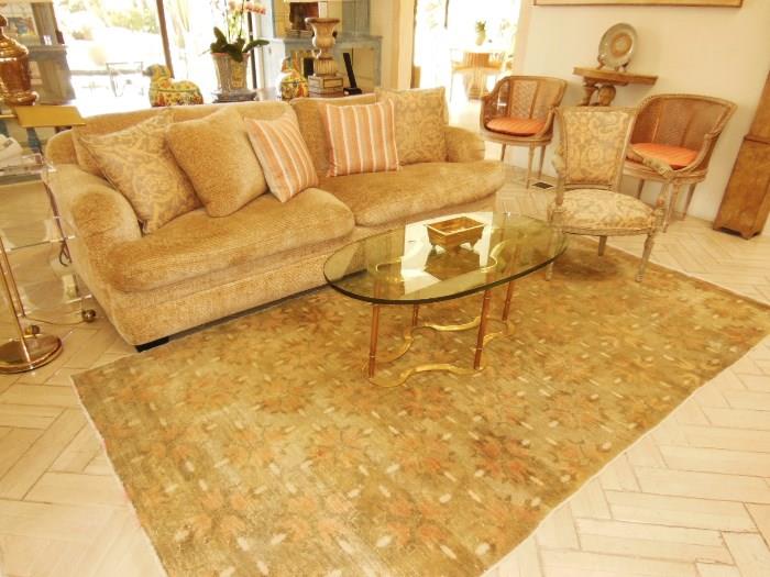 Beautiful Chenille Down Sofa w/ a brass glass-top coffee table (rug not for sale).