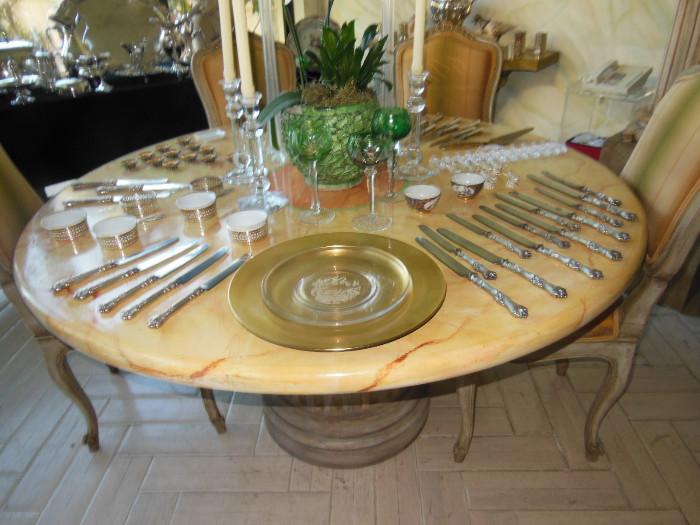 Faux-Marbelized Pedestal Table w/ an assortment of Silver, Crystal, and Sale Cellars