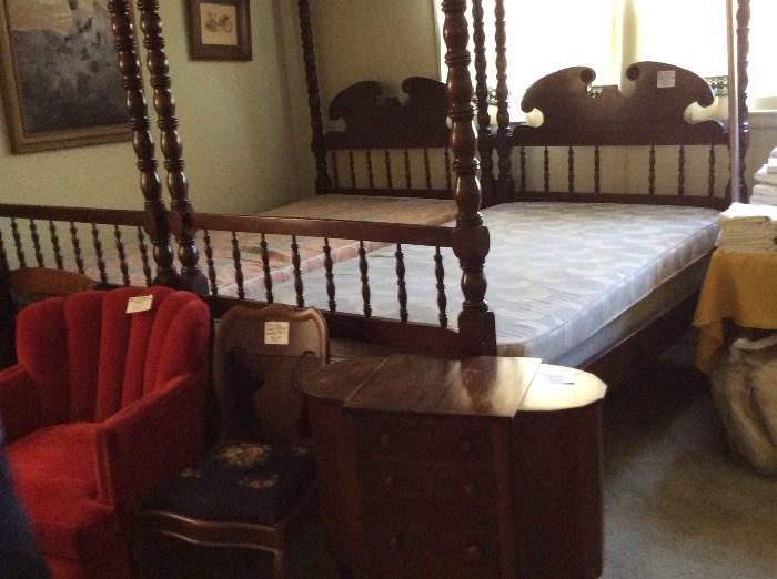 Custom made New Orleans Matrimonial beds circa 1920. Four poster and canopy, sewing table, red velvet chair, Victorian needlepoint chair, tables full of linens