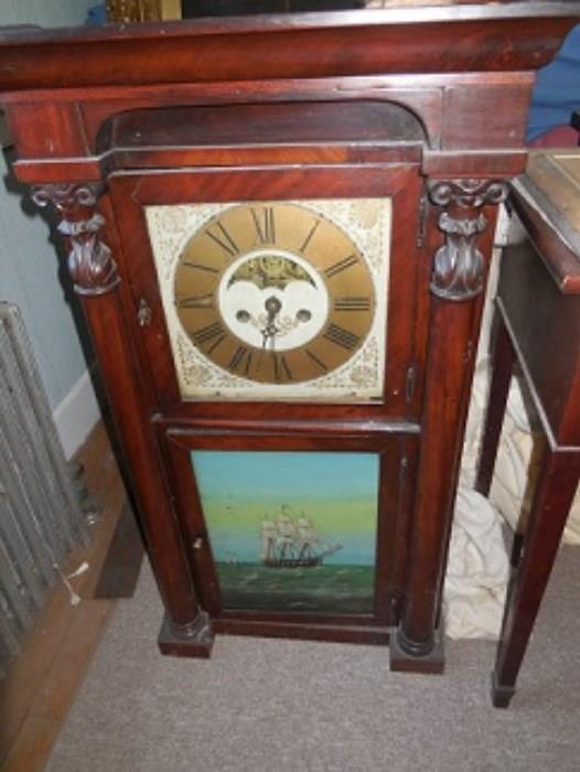 The Phillip Smith clock made in Marcellus, NY.  It is considered rare.  It is a beautiful clock.  It is an 8 day, full carved columns, reverse painting, and is # 142.  