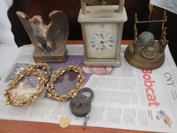 Sample of some of the small items.  Brass frames, inkwell, Eagle, and clock.  The clock has a bell on top. 