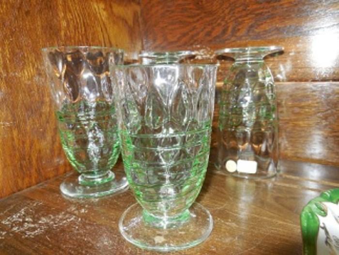 These are four  Steuben footed glasses with hand trimmed green.  Found the signature on each glass.