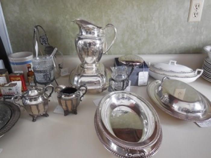 Some of the silver plate pieces.  The cherub on the upper left hand piece cannot  be seen to well but is a sugar server.