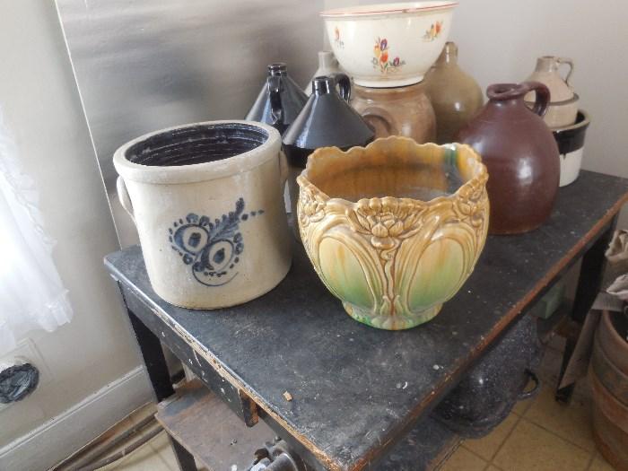 Crocks and planters.  The jugs are from Cortland and other places.  The one with blue has no maker marked on it.  