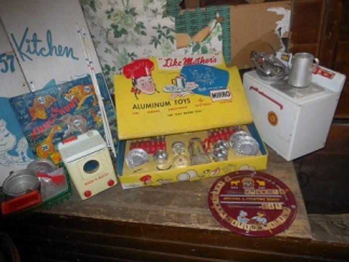 This is part of the Girl's kitchen toy.  An electric stove, wash-o-matic  washing machine,  new in box miro kitchen set, and  baking set,  