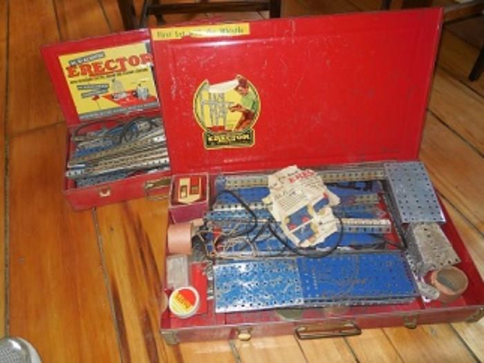 Erector Sets in original cases.  Both have motors.  One is bigger with more pieces. 