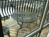 This cast iron bistro table and two chairs is perfect for a balcony or small patio.  Never used