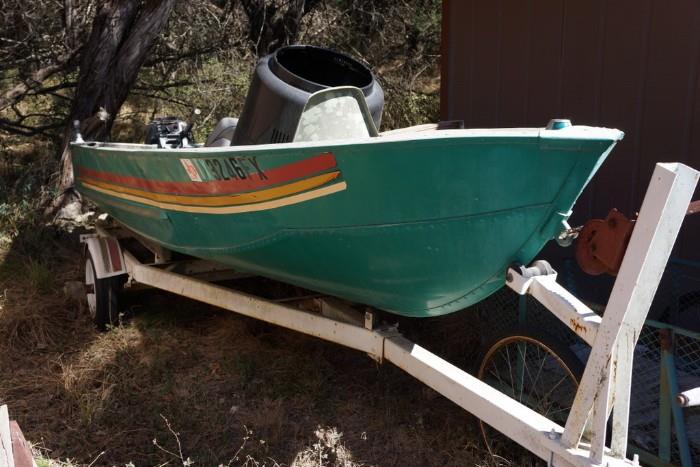 Old aluminum boat with 9.5 Evinrude motor