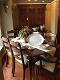 Pennsylvania House Dining Table with six chairs and two leaves set with Fostoria china, plus matching china cabinet.