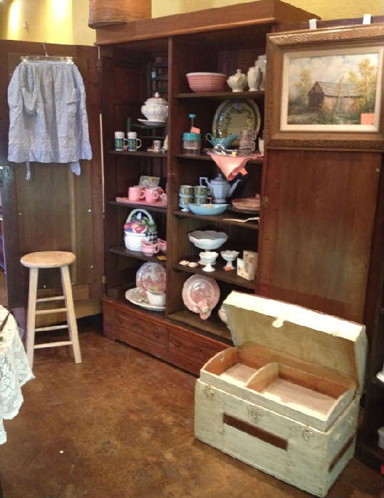 Antique trunk, aprons, dishes