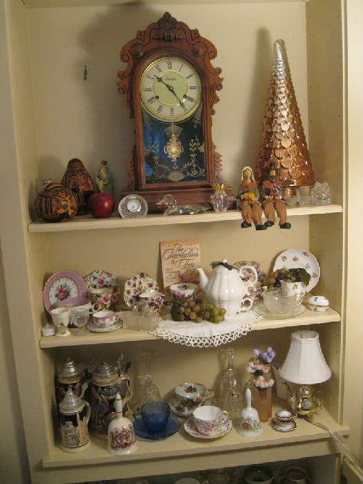 Antique clock - working w/key; steins and teacup collection....