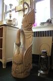 These swans came from a building in Florida that was being remodeled.  They are hand carved out of logs. The smaller one stands 24" x 12".  The larger one is 28" h x 13"w. Each sold separately.