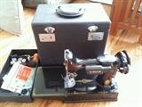 Excellent condition this Singer Sewing Machine with it's box and tools. Model #221-