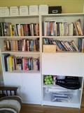 Lots of bookcases. Books. DVD's. CD's. And various stationary items.