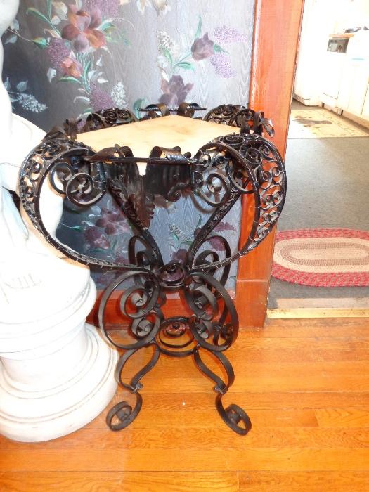Antique wrought-iron and marble plant stand