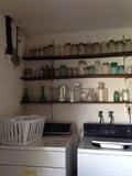 Collection of glass bottles and mason jars throughout the estate 