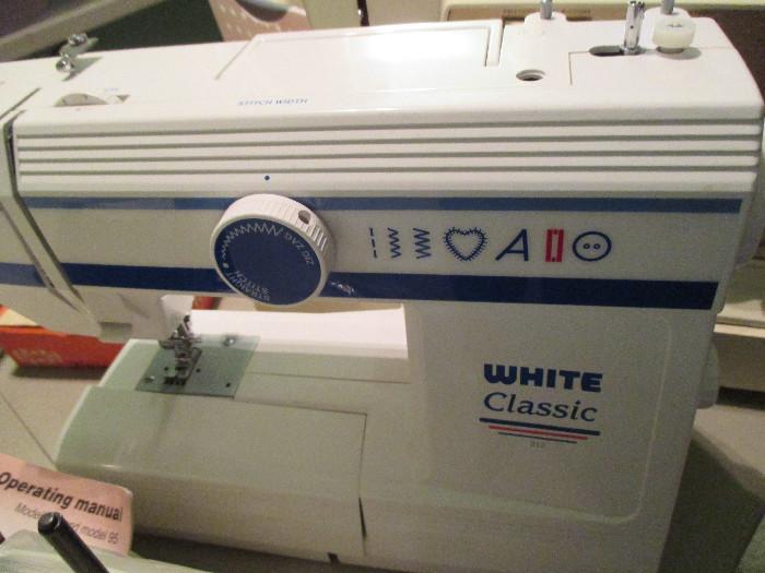 White Sewing Machine - there are 5 sewing machines