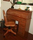 Roll top desk & wood office chair and green office lamp